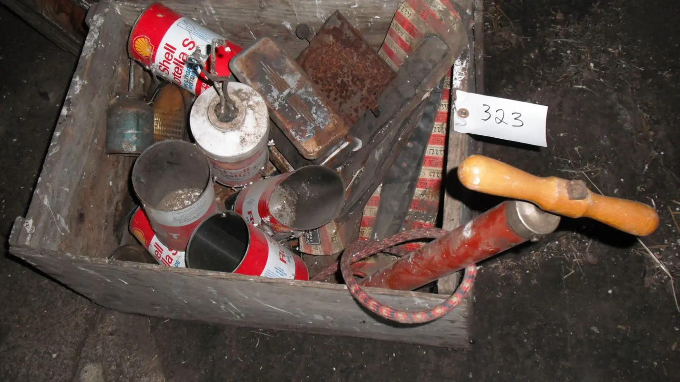 crate of tins, oiler, light, etc.