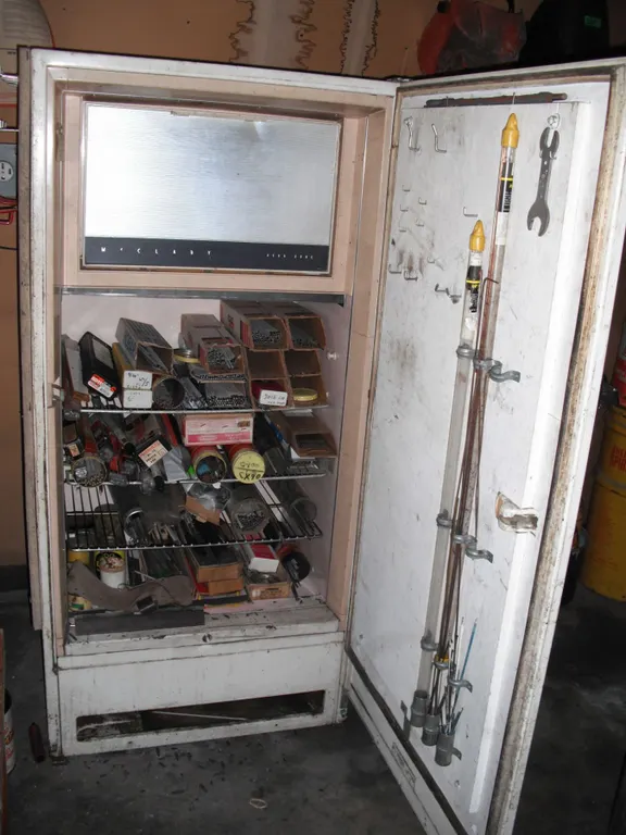 huge lot of welding rods in vintage McClary fridge