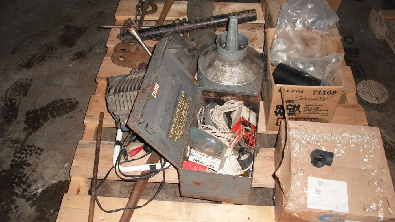 pallet of pipe fittings, funnels, tools, etc.