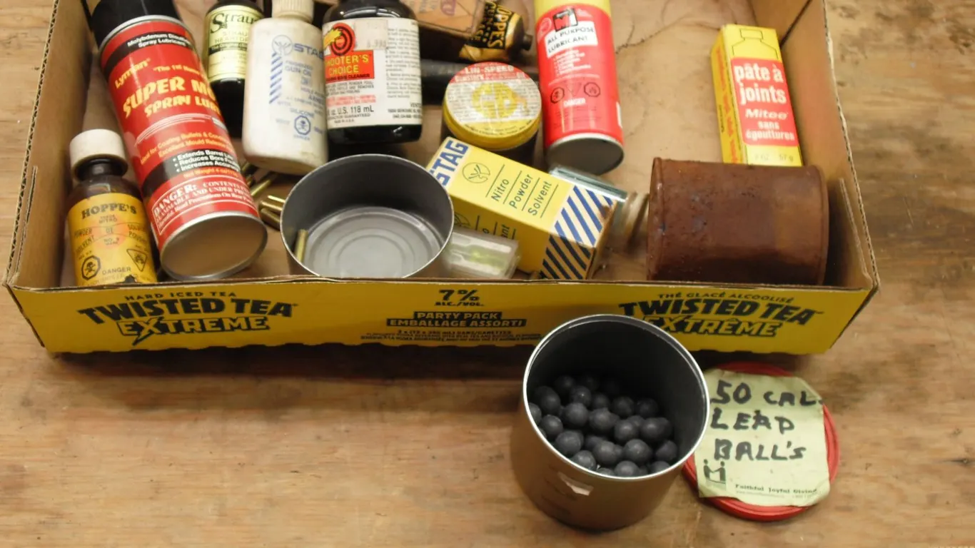 assorted gun related parts and cleaners