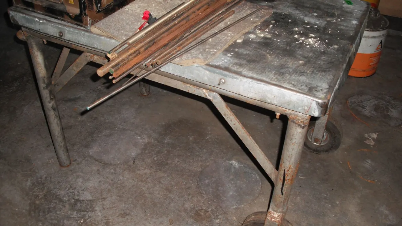 steel work talbe on caster w/ assorted metal rods - 41"x27"x28"H