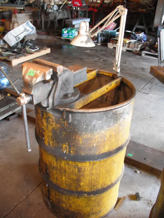 barrel made into workstand with bench vise (Canada) and work light