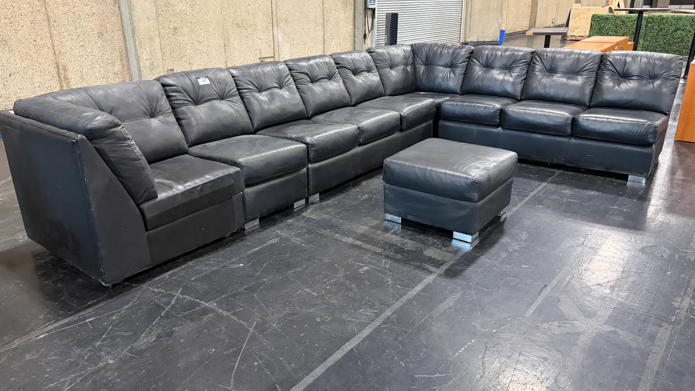 LARGE BLACK SECTIONAL SOFA WITH MATCHING OTTOMAN