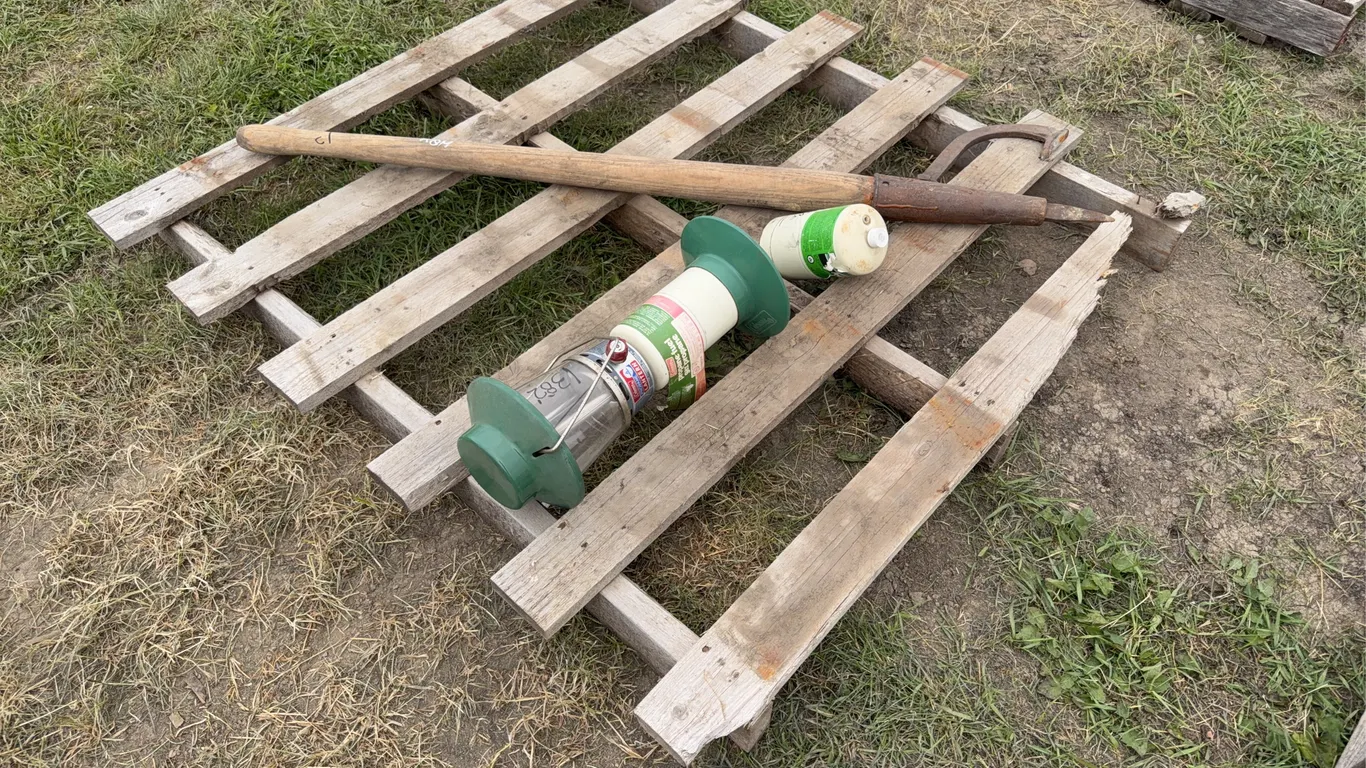Log roller w/ wood handle & steel head approx 53" H, Coleman propane lantern approx 18" h x8" base, w/ propane bottle,