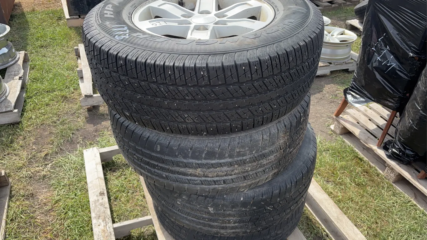 4 Goodyear Wrangler tires, w/ rings, on 5 Bolt Rims P265/70R17, *Unreserved*