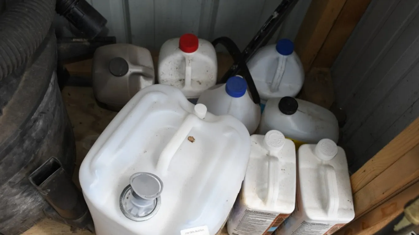 Cleaning Chemicals and Empty 5 Gallon Jug
