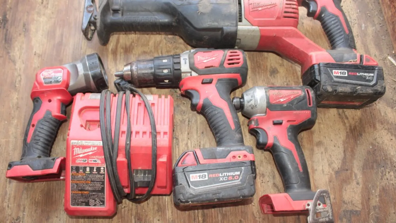 Milwaukee M18 Sawzall, Drill, Impact and Flashlight Has 2 Batteries and an M12 M18 Charger