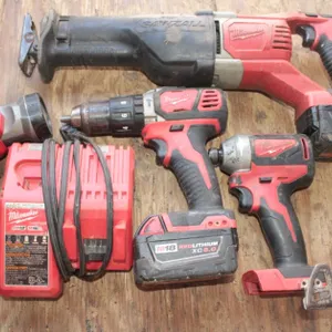 Milwaukee M18 Sawzall, Drill, Impact and Flashlight Has 2 Batteries and an M12 M18 Charger