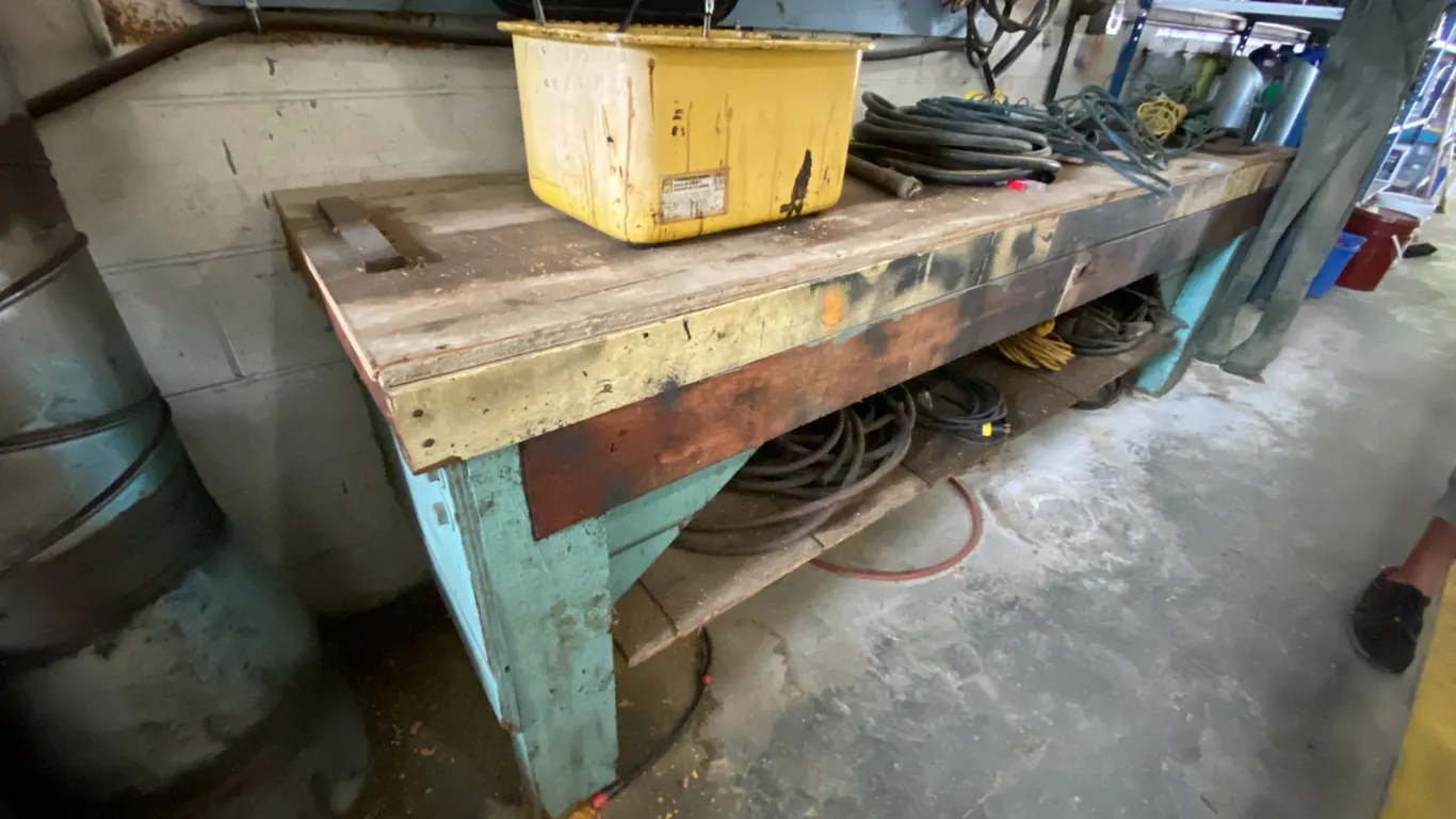 WOODEN WORK BENCH WITH ASSORTED SHOP CONTENTS- MEASURES APPROX 103"L X 24"D X 34"H