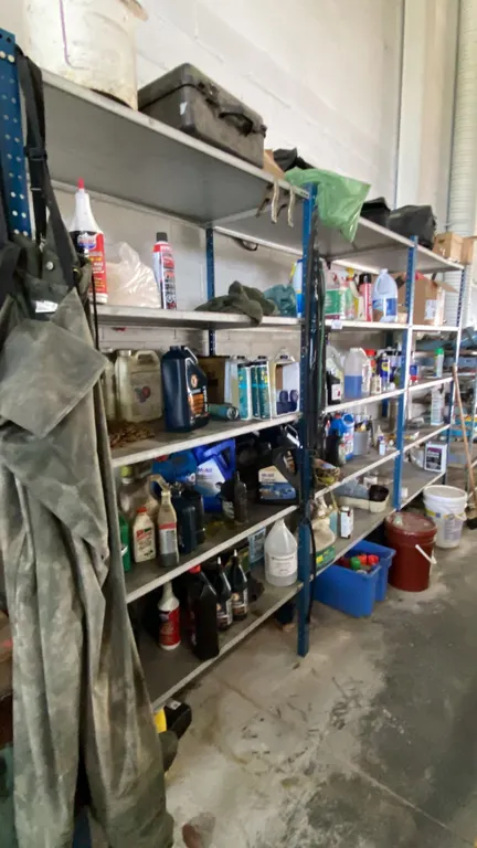 LARGE METAL SHELVING UNIT WITH ASSORTED CONTENTS- MOTOR OILS, GEAR OIL, MARKING PAINT, LUBRICANTS,