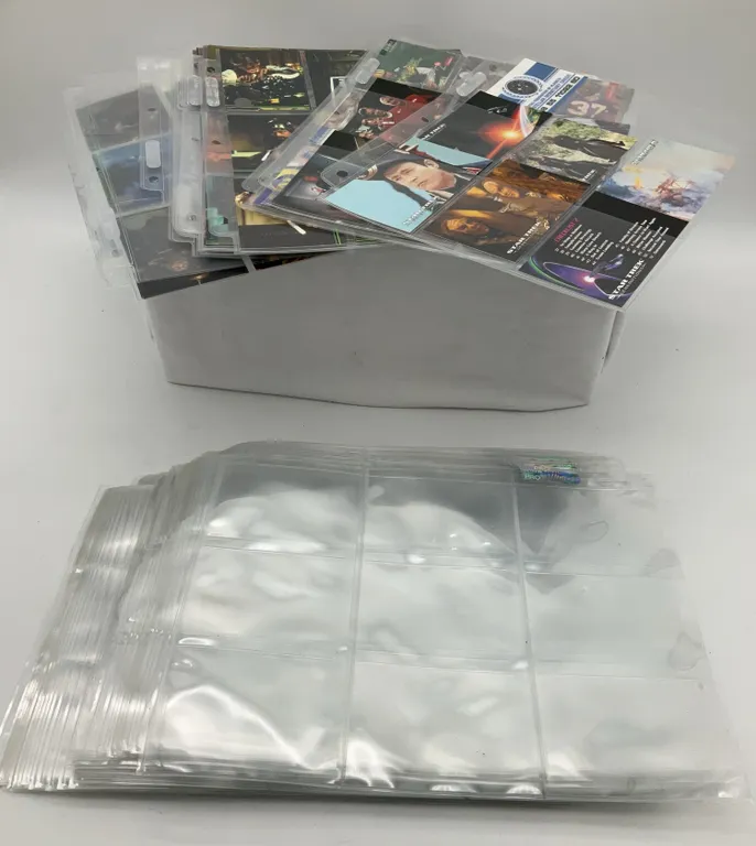 Assorted Trading Cards and Extra Plastic Sleeves