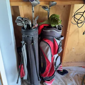 Golf Bags with Assorted Golf Clubs