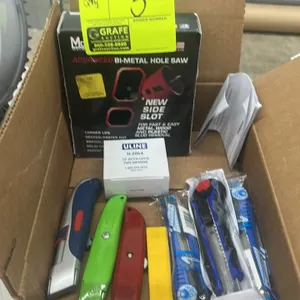 Hand tool lot. Includes assorted box cutters and utility knives, Uline H-2064 12' Accu-Lock tape measure, and a Morse Advanced bi-metal hole saw.