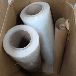 Uline S-3212 cast stretch wrap and packaging paper rolls. Includes two rolls of clear stretch film and one roll of kraft packing paper inside box.