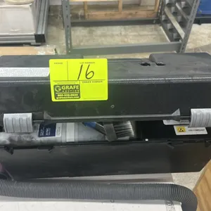 SCS electronic service vacuum. Features ESD-compliant portable case design with carry handle, flexible hose, brush attachment, and filter cartridge.