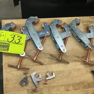 Kant-Twist cantilever clamps. Features steel construction with copper-plated threaded spindles, rotating jaws, and assorted sizes including T-handle a