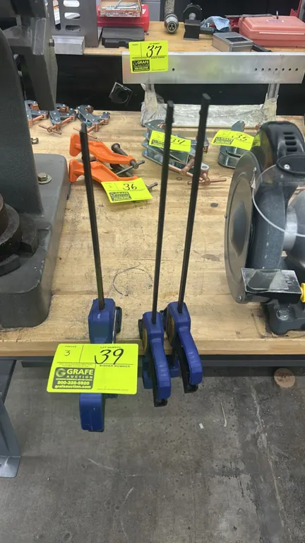 Irwin QUICK-GRIP one-handed bar clamps. Features quick-release trigger mechanism, durable resin construction, and steel bar.