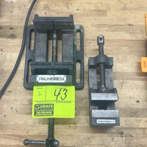 Palmgren drill press vises. Includes (1) slotted-base drill press vise with handle and (1) traditional drill press vise. Features machined jaws and ma
