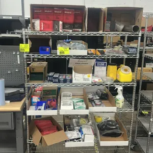 Assorted safety and shop maintenance supplies. Includes Webril Handi-Pads, Uvex safety glasses, Uline respirator masks, 3M filter cartridges, Scotch-B