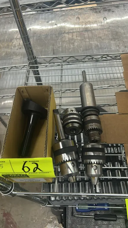 Milling tooling lot. Includes (1) R-8 shank fly cutter and (4) keyed drill chucks with various arbors and mounts.