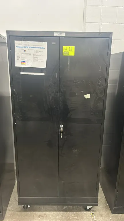Tennsco metal 2-door portable locking storage cabinet. Features double doors with locking handle, adjustable interior shelving, and mobile casters. In