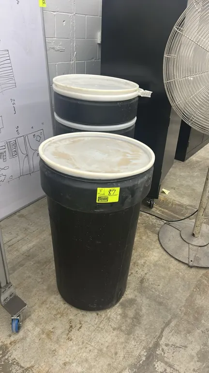 Poly storage barrels. Features black molded polyethylene construction and removable plastic lids.