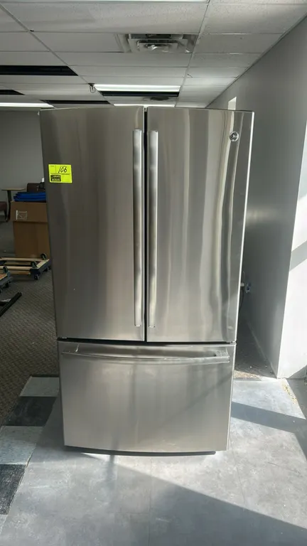 GE GNE26GSDFSS French door refrigerator with bottom freezer. Features stainless steel finish, black cabinet, adjustable glass shelving, dual crisper d