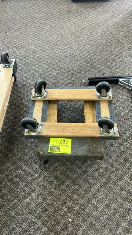 Wooden 4-wheel shop dollies. Features solid wood frame construction with carpeted ends. Mounted on 4 swivel casters.