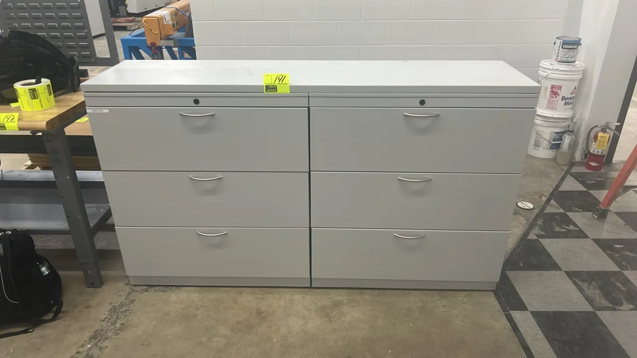 Metal 3-drawer lateral file cabinets. Features metal construction, light gray finish, bow drawer pulls, and top lock cylinder. Dimensions: 72" x 18".
