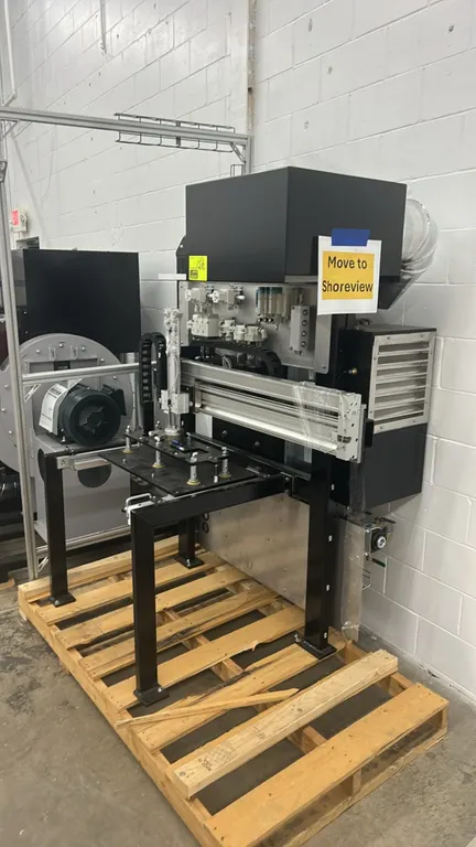 Heavy-duty 3D printing machinery. Features linear motion rail assembly, pneumatic components, cable track carrier, blower assembly, and exhaust ductin