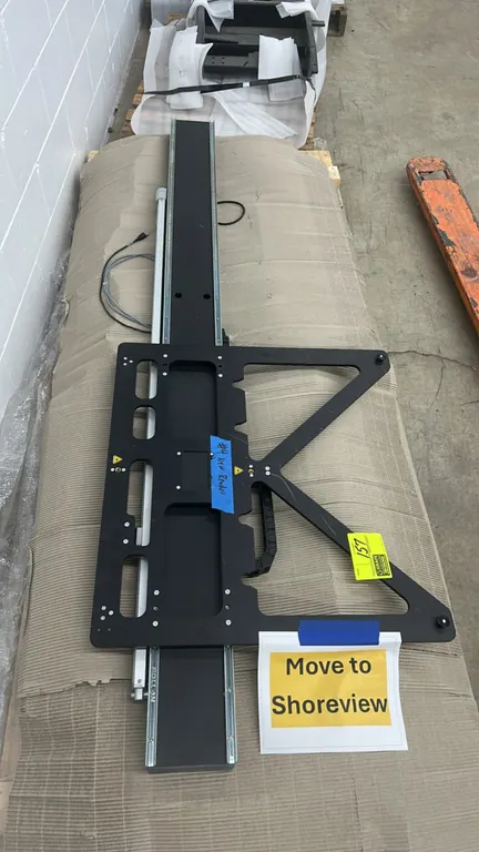 Rollon industrial linear actuators. Features linear guide track assemblies with mounting carriage brackets, integrated cable carrier drag chains, and