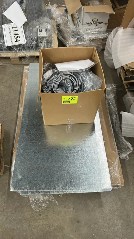 Assorted electrical wiring, cords, and sheet metal package lot. Includes a box of assorted coiled wiring harnesses, cable assemblies, paperwork, and s