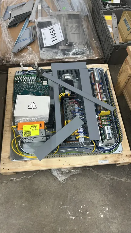 Industrial control panel backplate assembly. Features B&R Automation PC, Evolve circuit board, terminal blocks, DIN rails, digital controller module,