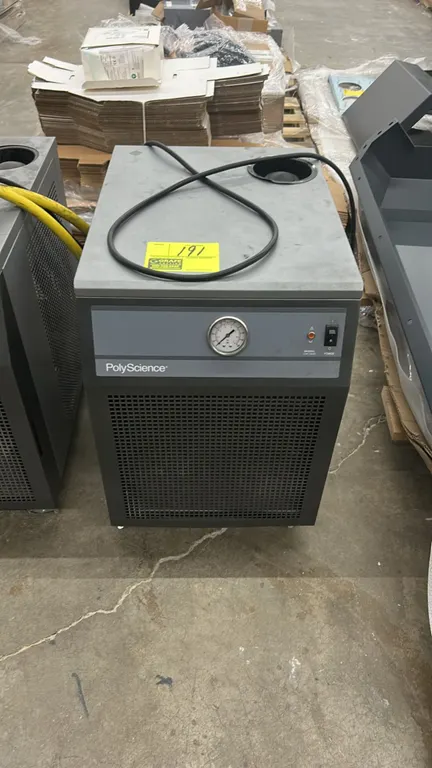 PolyScience 3370 liquid-to-air cooler. Features a front analog pressure gauge, power switch, status indicator light, and top reservoir fill opening.