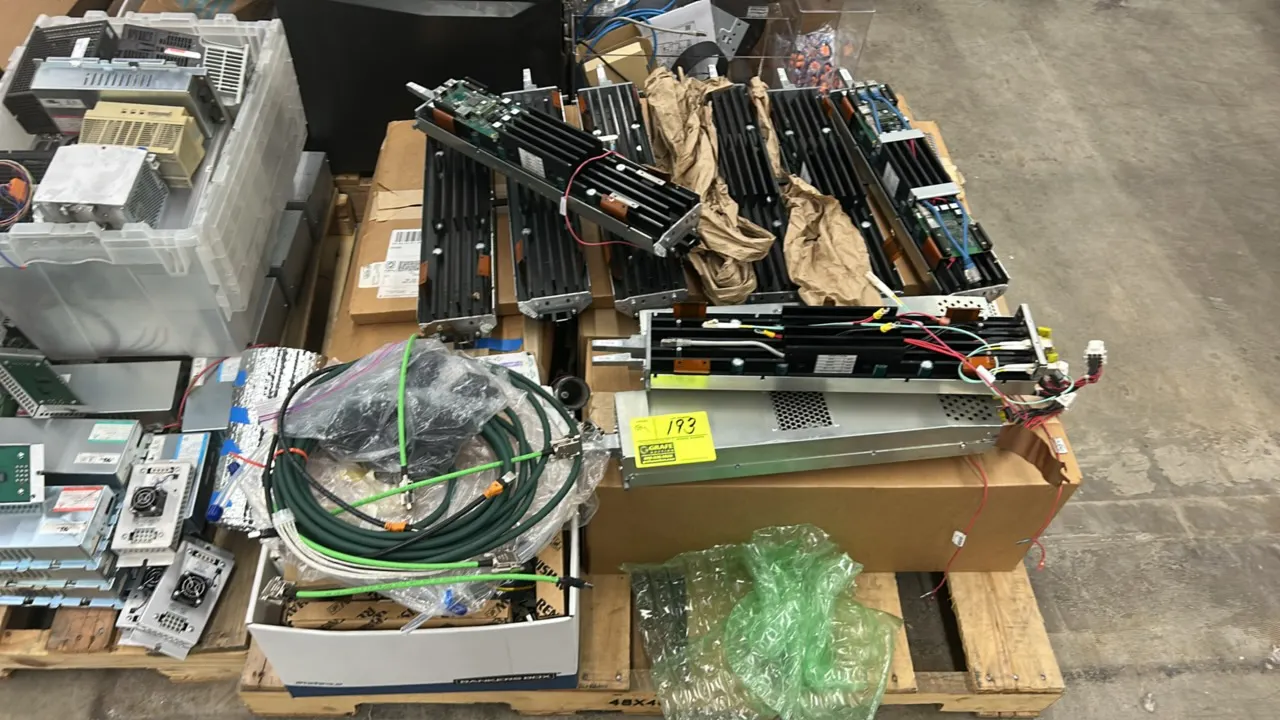 Lot of internal modular electronic components, assorted cables, precision-machined metal ring, and remaining pallet contents. Includes modular finned