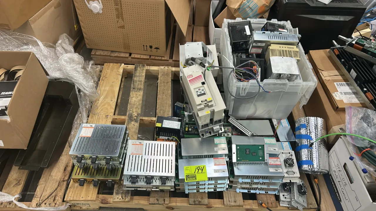 Assorted industrial electronic power supply and control modules. Includes enclosed AC-DC switching power supplies, KEB drive controller, circuit board