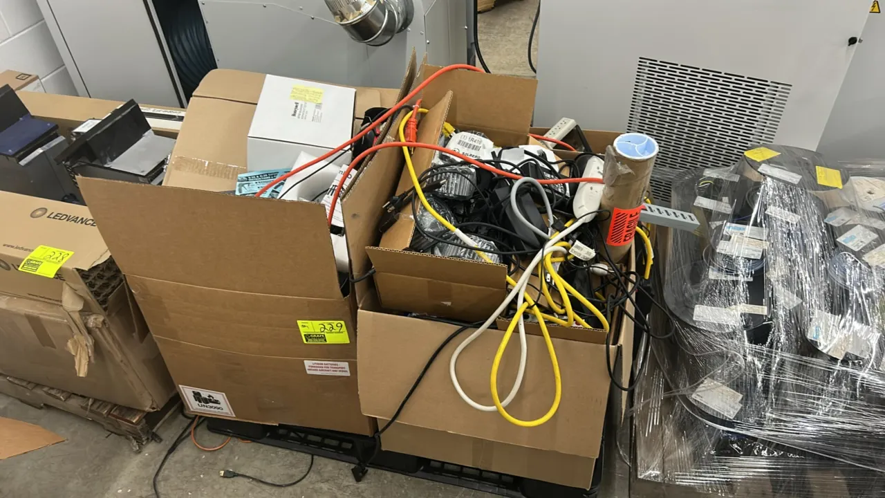 Assorted IT equipment and computer accessories. Includes Supermicro tower computer, keyboards, computer mice, headphones, power strips, assorted power