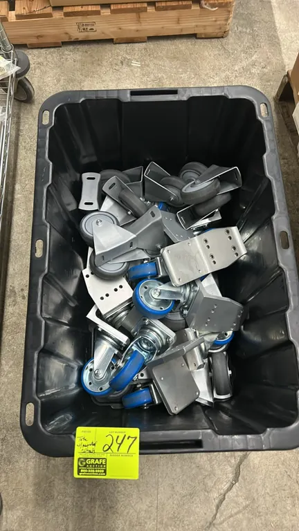 Assortment of steel plate caster wheels. Features a mix of rigid and swivel casters with steel mounting brackets and plates. Includes HDX plastic stor