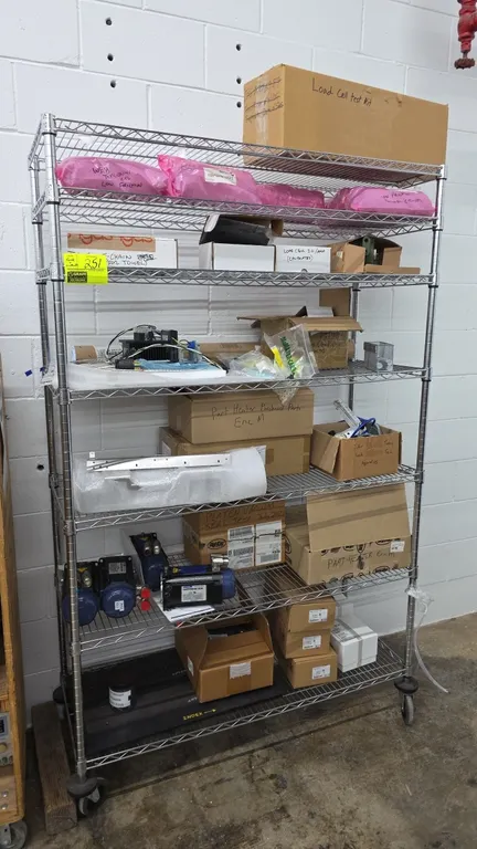 Perfect Home 7-tier chrome wire shelving unit with assorted industrial components. Includes Motion Ai web tensioner cylinders, load cells, heater part