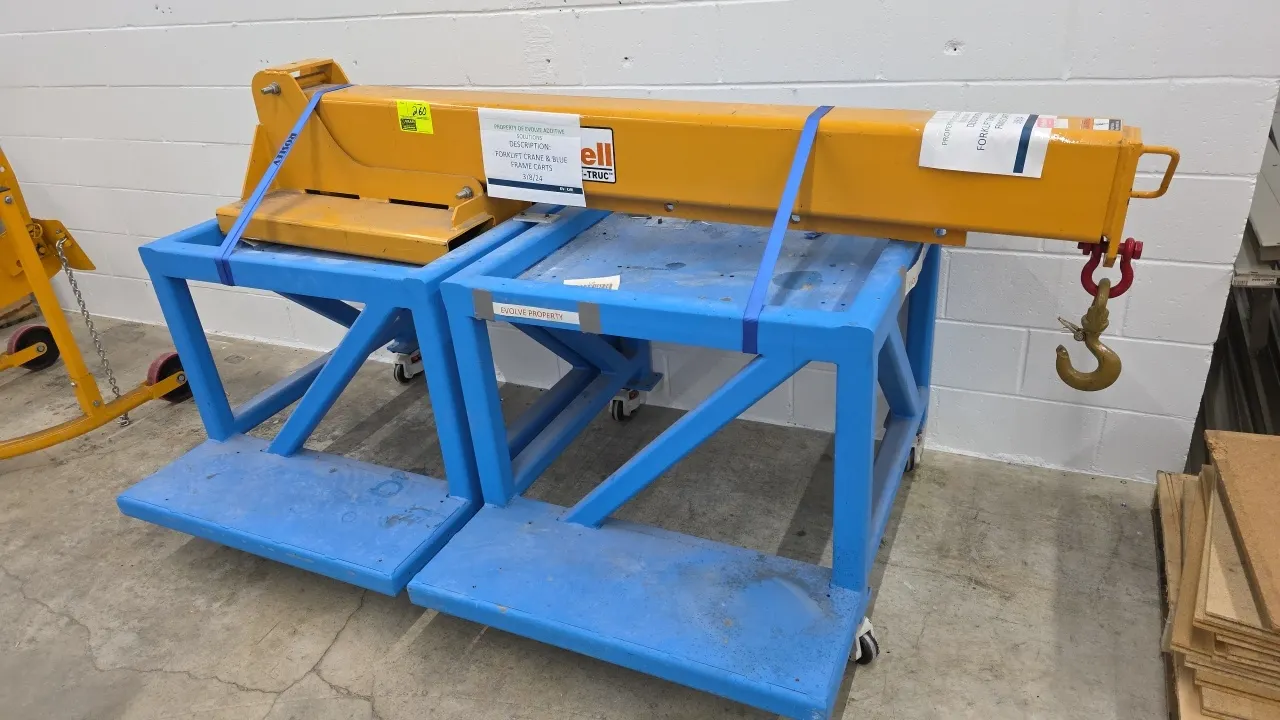 Caldwell FB-80 telescoping forklift jib boom with (2) heavy-duty rolling carts. Features swivel hook with safety latch and forklift pocket mount. Rate