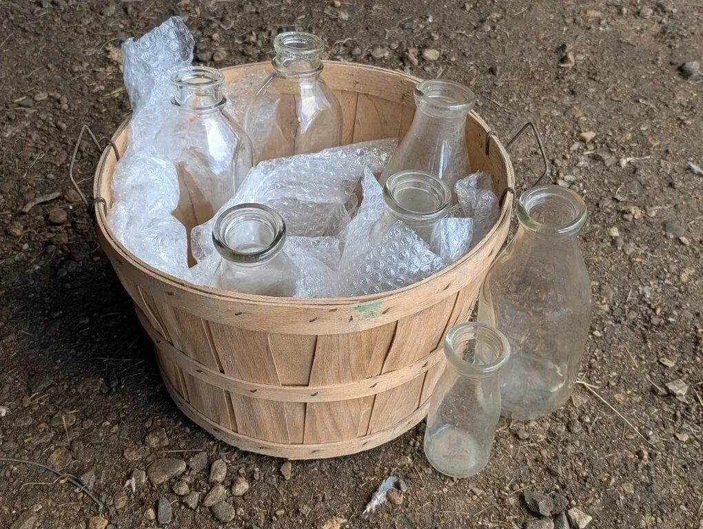 Vintage Apple Crate and Glass Milk Bottles.
