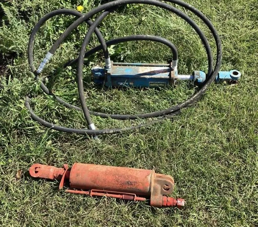 Two 8 inch hyd cyl one with hoses