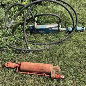 Two 8 inch hyd cyl one with hoses