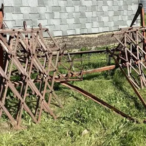 Fold up harrow bar with 6 diamond harrows