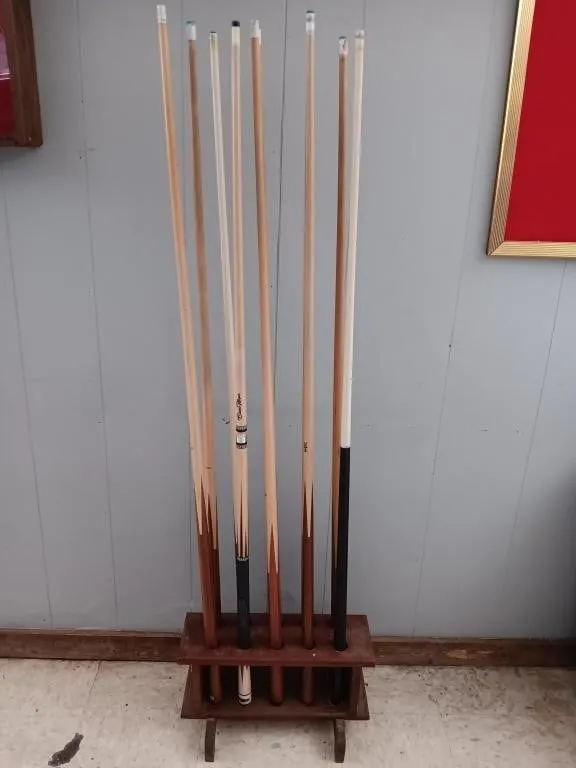 Pool cues and floor stand
