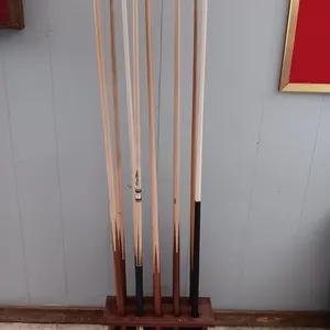 Pool cues and floor stand