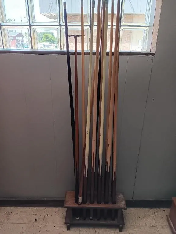 Pool cues and floor stand