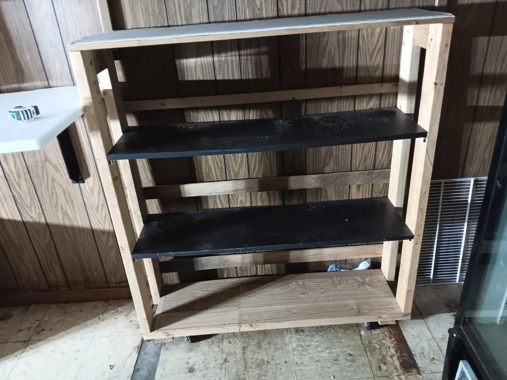 Four Tier Shelf On Wheels. Approx 51x46x13.