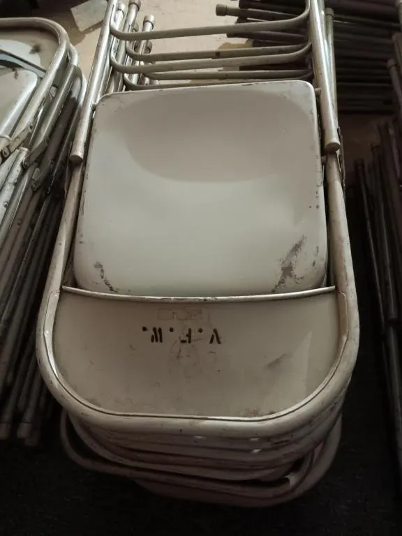 Ten metal folding chairs