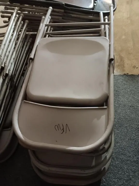 Ten metal folding chairs